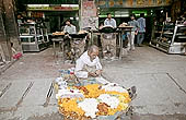 Varanasi - pilgrims purchasing flowers for puja 